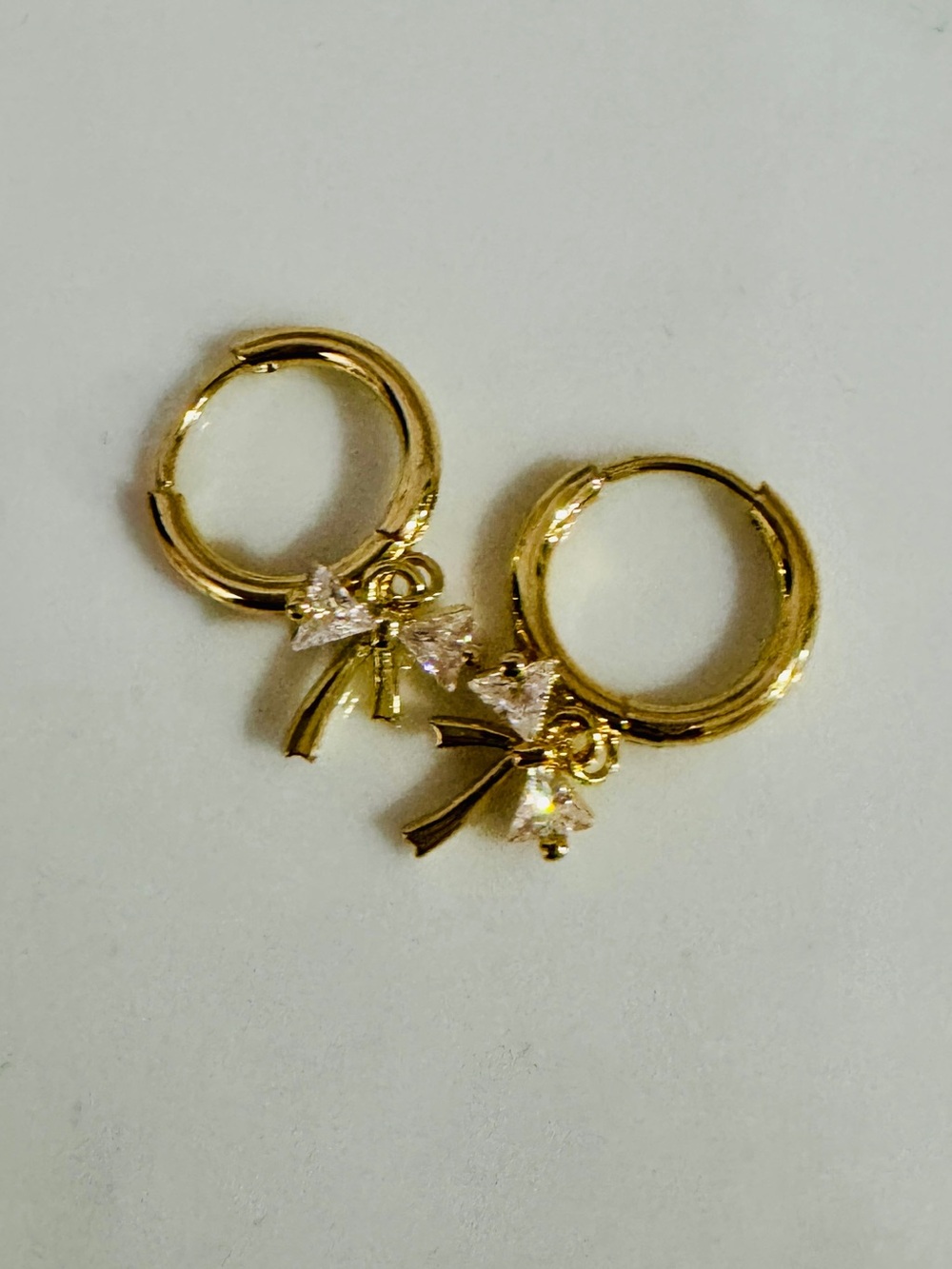 Teeny Tiny Gold Bow Hoop Earrings with Crystal Accents